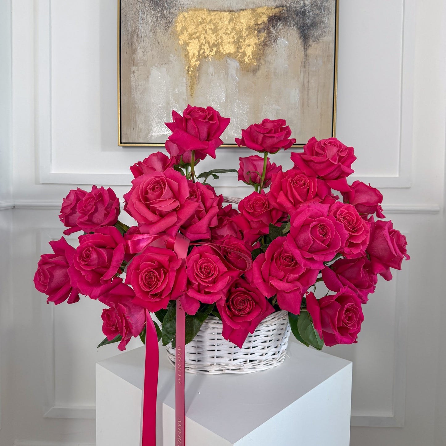 Luxury basket arrangement of dark pink reflexed roses by AMEROSE London