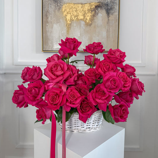 Luxury basket arrangement of dark pink reflexed roses by AMEROSE London